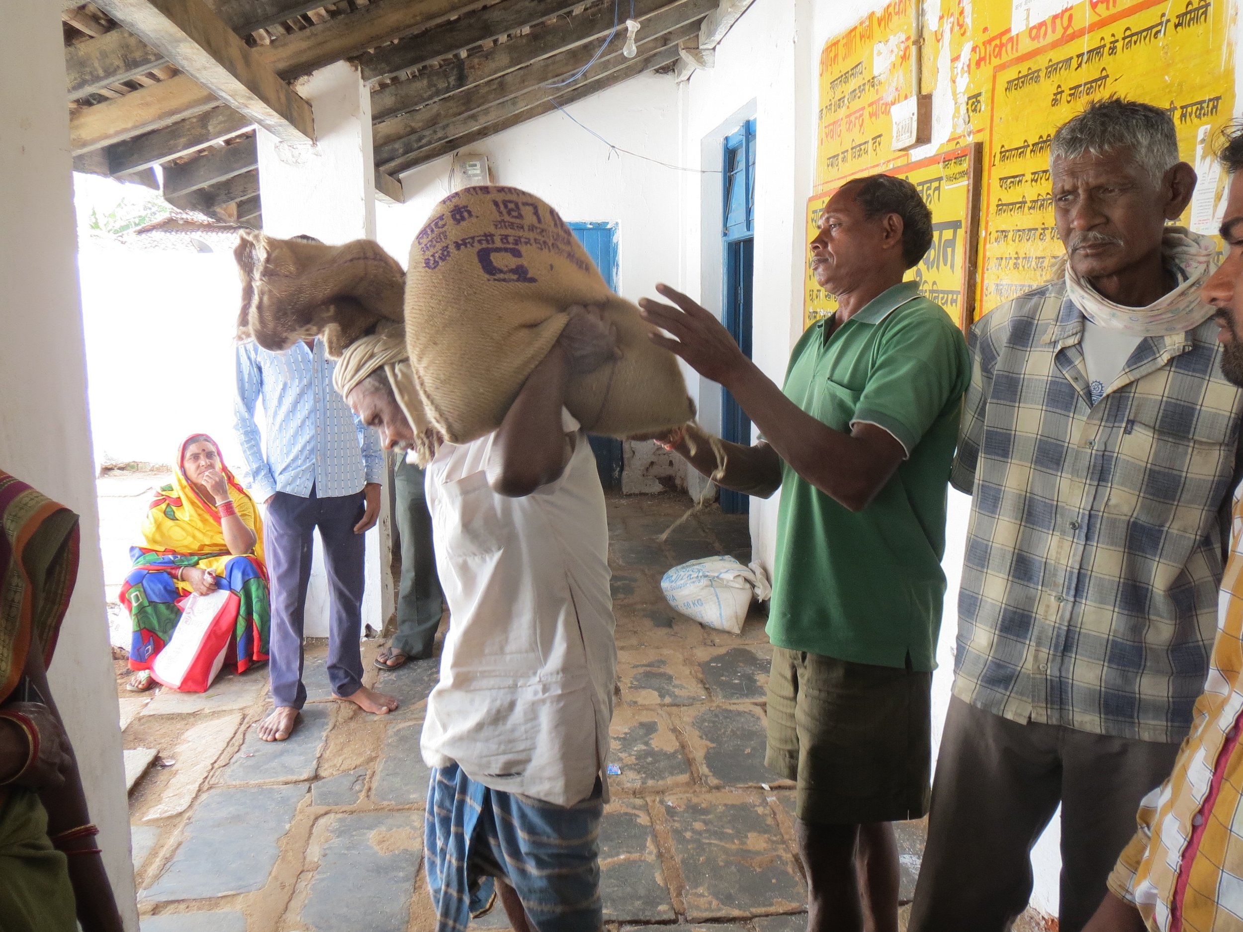 Ram Lal, a ration card holder in Dhamtari, Chhattisgarh takes his ration of 35 kilo rice home.